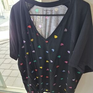 Woman Within Black Top with Colorful Heart Accents